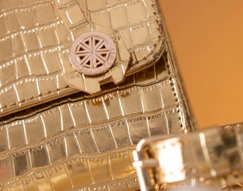 Abenipoise Gold Leather Handbag